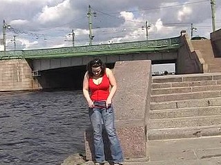 Wet slut urinating riverside in summer